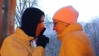 Girlfriend with glasses gives outdoor blowjob on a snowy day