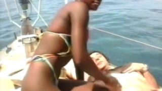 A slutty amateur ebony babe gets her wet pussy fucked on the beach by white lover