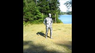 armed zentai skeleton outdoors in the sun