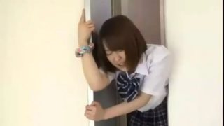 Japanese babe stuck in elevator doors and fucked