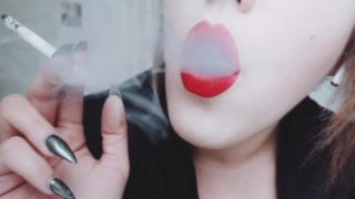 MISTRESS WITH LUSCIOUS RED LIPS CLOSE-UP SMOKING CIGARETTE