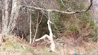 Naked self-bondage in the woods gone wrong.