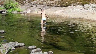 Jacking off big load of cum on a public river