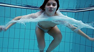 Brunette lean fresh Russian teen underwater shows her hairy pussy