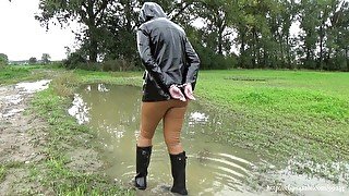 Muddy walking in wellies and handcuffs