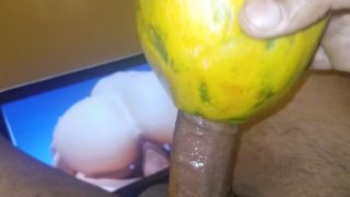 Beating my cock to porn with wet juicy fruit til i bust a huge load of cum
