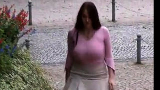 Busty girl walking, no bra, jiggling