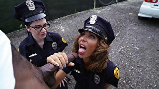 Spicy female cops share black guy's cock in dirty public kink