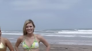 Flirtatious teens in sexy bikinis show off their nice tits outdoors