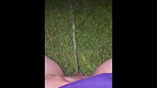 spraying piss in backyard