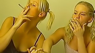 Cigarette smoking blondes seduce a fellow for a threesome