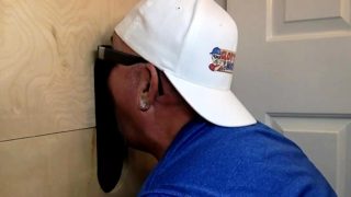 Mature daddy sucks black dick through gloryhole