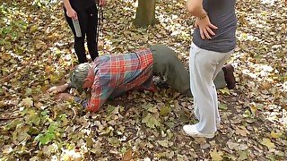 Mistress Ronja and Lady Lucy are showing off their dog in the wood.