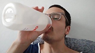 boy drinking a cup of water to be healthy