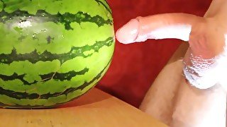 eating and playing with cum after fucking a melon and cumming into a condom