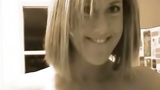 Cool looking busty blonde milf in black sucks on hard cock in her kitchen