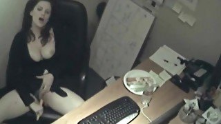 Busty babe fucks a carrot in her office