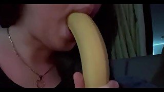 At home watching tv while im sucking a banana