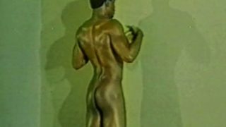 Classic movie of a black dude working out and posing, then jacking off