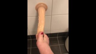 Cute small feet on a dildo