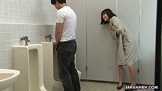 Crazy Asian chick Uta Kohaku pisses on dick of one stranger dude in a public toilet