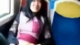 Asian milf rubs her clit on a train.