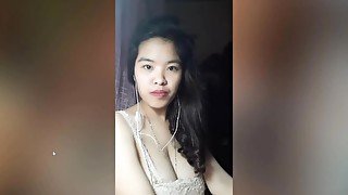 Vietnam  brunette bares her big boobs to play with them