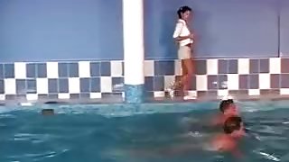 Two guys moving staff to the pool