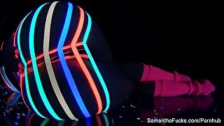 Colorful blacklight teasing with Samantha Saint