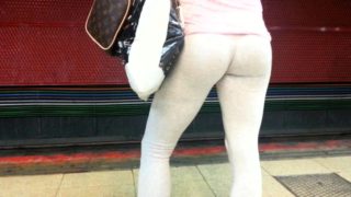 Street voyeur finds a striking brunette in tight white pants