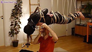 Girl in leather catsuit gets Shibari energy tied, suspended, nipple clamps. Real uncut play!