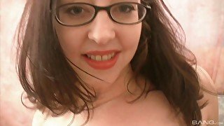 Long haired teen brunette sucks a cock while wearing glasses