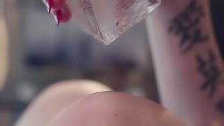 Kinky tattooed slut loves the feeling of ice dripping into her mouth, on her body