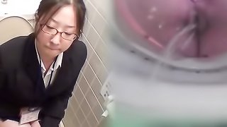 Nurse is caught on candid camera in restroom, having a pee