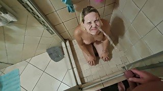 Blonde getting a golden shower in the shower  face piss  watersports