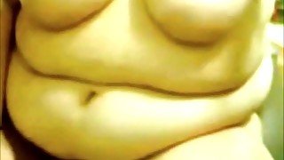 Close up on fat tummy as she masturbates