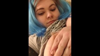 Girl with colored hair plays with her big fat tits