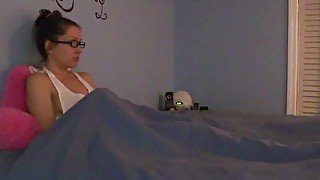 Shy nerdy girl masturbates under the sheets in pajamas