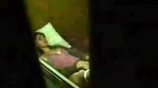 Cute brunette caught masturbating by a window peeper