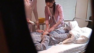 Spy cam catches two Japanese nurses pleasuring a horny patient