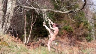 Naked self-bondage in the woods gone wrong.