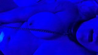 Collared, chained and playing with myself under a blue light.