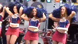 Cheerleaders in short skirts on stage at show