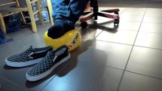 Male Shoeplay with beach ball in Under Armor, Vans Slip Ons, Black Socks