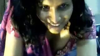 Happy genuine Indian lady in saree milks her boobs on webcam