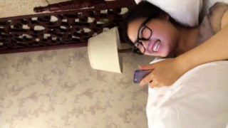 Nerdy Japanese girlfriend enjoys hot sex action on the bed