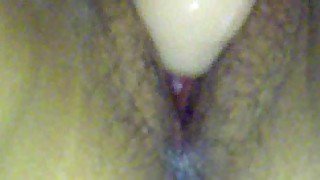 Close up on her young pussy during dildo play