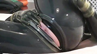 Girl In 2 Layers Of Latex Catsuits Black + Transparent With Gas Mask + Piss