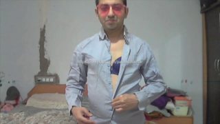 Sissy boy in a Bra inside the shirt with pantie & sunglasses, after that removing it all.