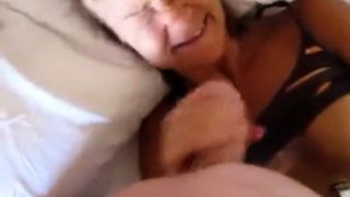 Buxom mature blonde fingers her cunt and gives a POV handjob